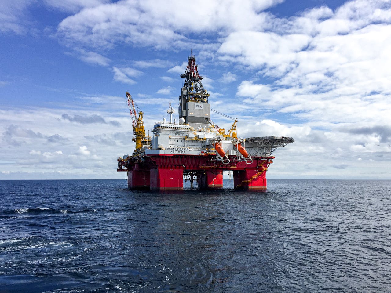 The Art of Drawing Readers In: Your attractive post title goes here Majestic offshore oil platform under a bright sky in the North Sea, showcasing Norway's energy infrastructure.