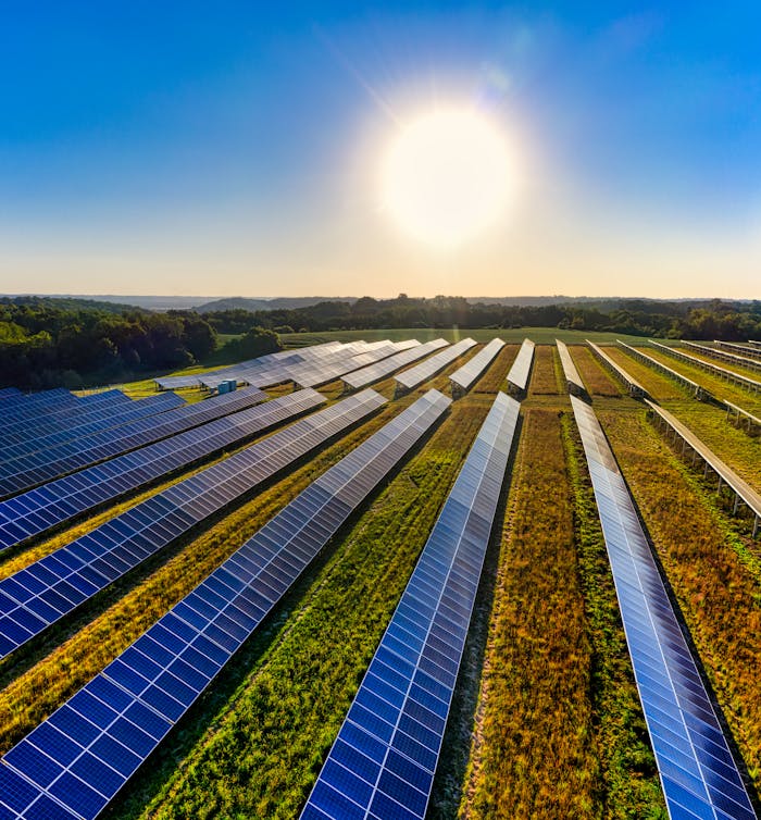 Aerial view of a solar farm in Red Wing, MN, with solar panels harnessing the sun